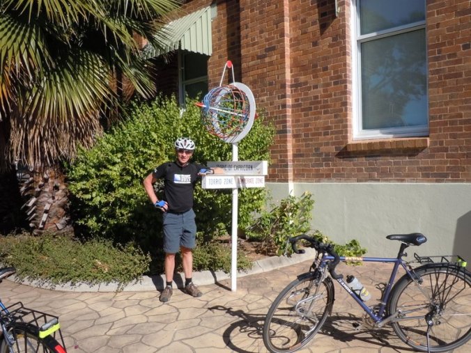 Dave at Tropic of Capricorn sign in Longreach