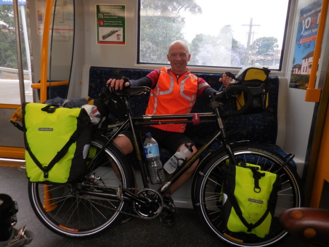 Dave on the train with his new hi-vis bags