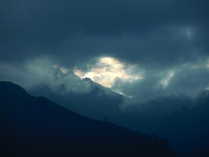 Sunset from our apartment - sun fighting cloud