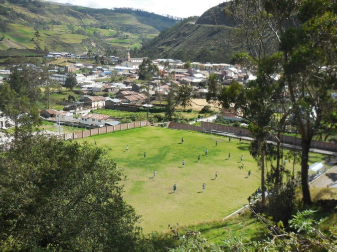 Looking down on town and a soccer match