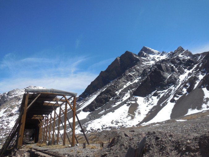 Old train tunnel and mountains