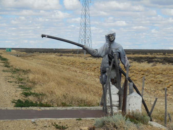At the start of the dirt road