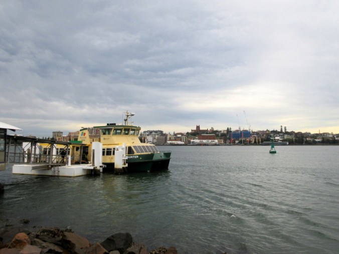 Stockton ferry with Newcastle in background